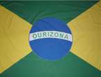 A Bandeira do Municpio de Ourizona foi instituda pela Lei n 02/69.  Nesta Lei consta que a Bandeira dever ser confeccionada em 4 cores,ou sejam: verde, amarelo, azul e branco.  O Braso e a Bandeira, so de autoria da professora em Artes Plsticas e Desenho (Artsitico e Publicitrio) Eunice Barbosa Machado.  	   Atravs de seu memorial descritivo, pode ser historiado de acordo com o simbolismo de suas figuras e cores.  Escudo: modelo portugus, tradicionalmente usado no Brasil; no centro do qual se destaca uma faixa transversal (cor verde), na qual trs estrelas em amarelo representam os fundadores do municpio, sendo estes os senhores: NICOLAU NASSER, HERMENEGILDO CALVO E LZARO DE LIMA  Na parte superior do escudo na cor amarela destaca-se o smbolo da BALANA representando a Justia, o equilbrio nas decises dos momentos de maior importncia na vida do municpio.  Na parte inferior do escudo na cor vermelha, destaca-se um ramo de trigo, este representando o alimento extrado de sua rica terra, a renovao agrcola e a economia principal, a agricultura mecanizada.  CASTELO COM 5 TORRES - Representa a sede do municpio, com seu poder, sua autoridade e suas leis. A fortaleza de um povo que atravs de seu trabalho, muito confia e espera.  RAMOS DE CAF - Dois ramos de caf formam uma haste como suportes  direita e  esquerda, estes representam a riqueza da poca da colonizao, o caf deu origem  formao do municpio. BASE - Na base um Listel de cor amarelo ostentando os seguintes dizeres: 25-7 - OURIZONA - 1960. A primeira numerao significa a data da emancipao poltico-administrativa e na segunda o ano do acontecimento.  